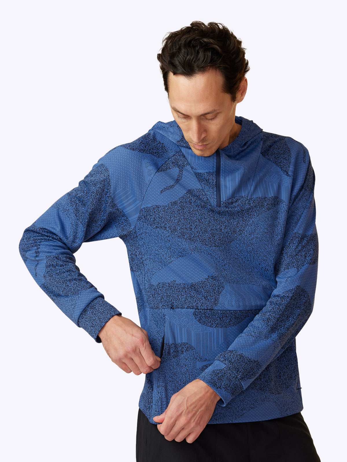 Side profile of Loogaroo Pulse Hoodie in Oceana, revealing the hoodie's sleek design and pocket detail