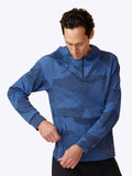 Side profile of Loogaroo Pulse Hoodie in Oceana, revealing the hoodie's sleek design and pocket detail